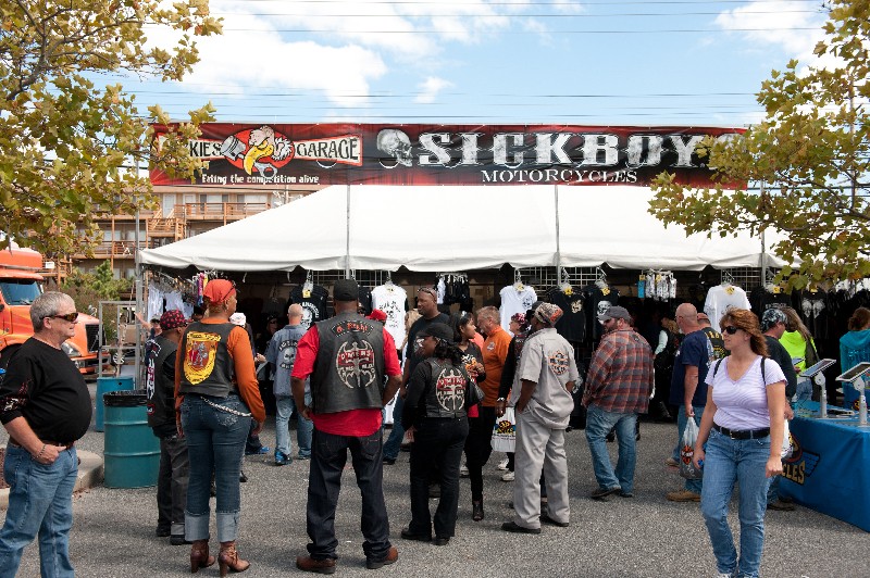 event attendees lining up for SICKBOY MOTORCYCLES vendor tent