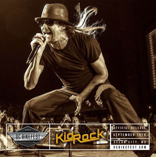 Kid Rock singing with mic on stage